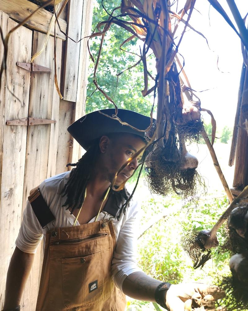 Khonsu looks at braided garlic