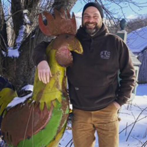 farm manager lee with metal chicken