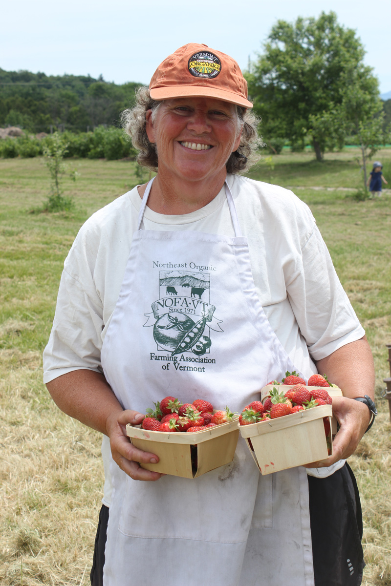 Enid Wonnacott, NOFA-VT's executive director, shows off her marvelous harvest: organic strawberries from Last Resort Farm