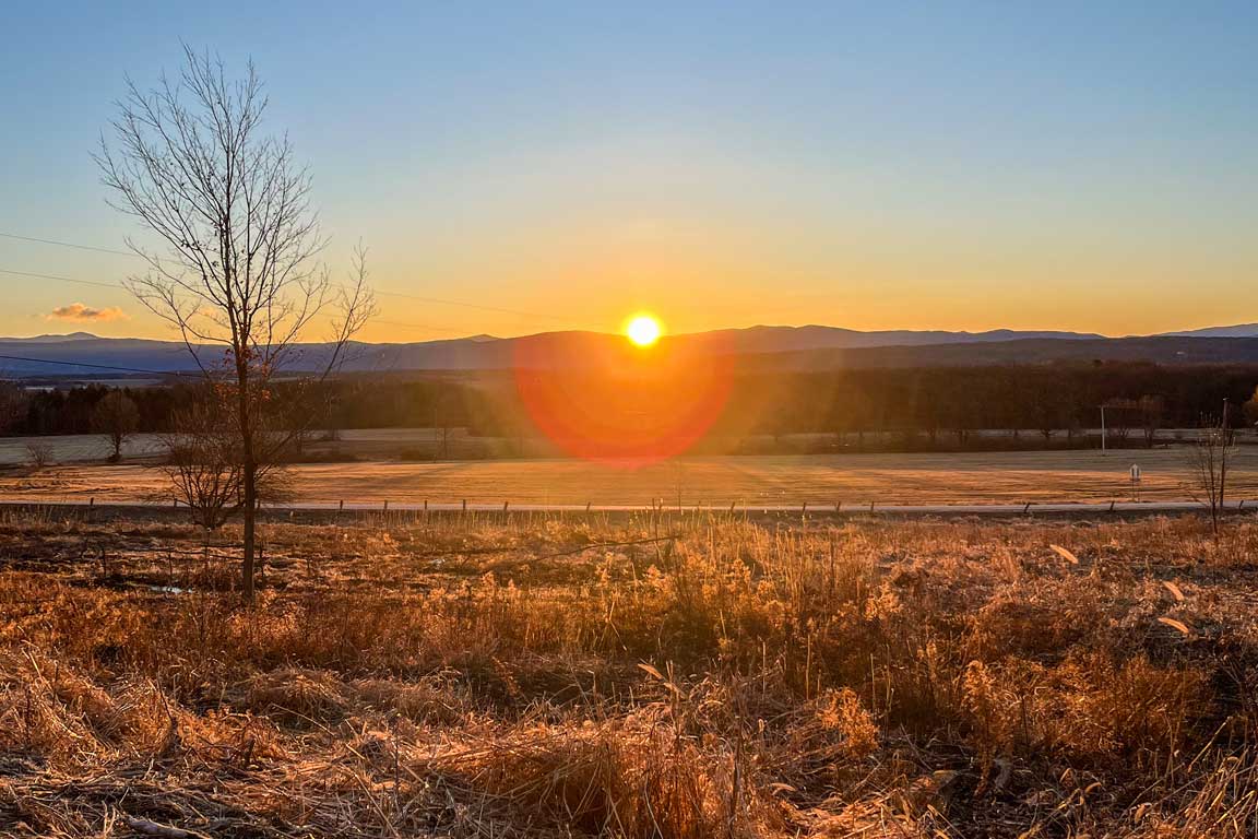 sunrise over Vermont agricultural fields