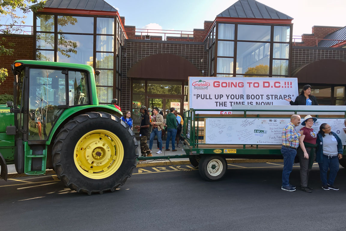 A tractor driven to Farm Aid by a Connecticut farmer to raise awareness about farmers' need for assistance in the wake of climate change-fueled farm damage