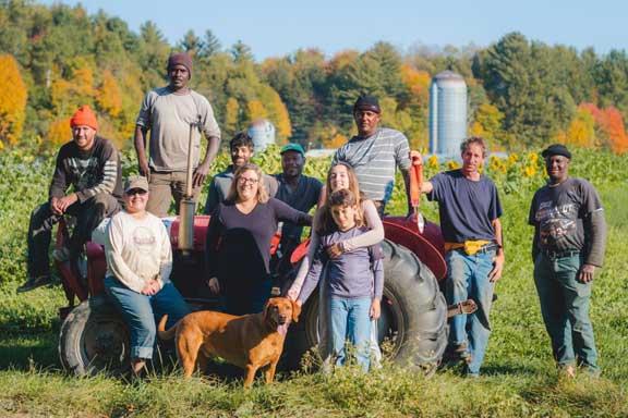Foote Brook Farm crew surrounding their tractor