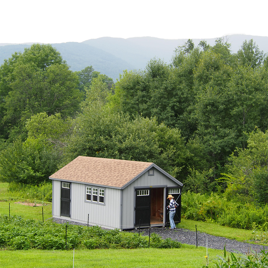 A small shed by a garden.