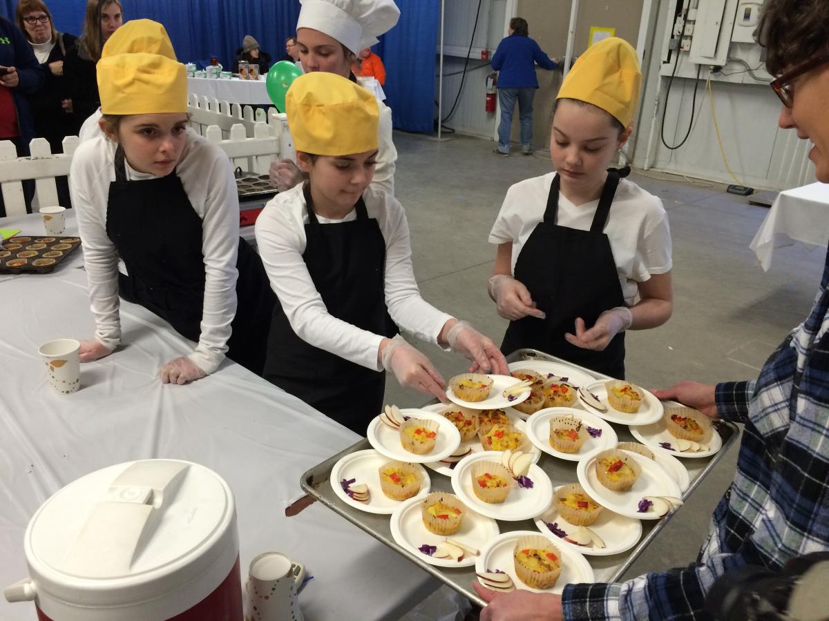 A middle school team plates its entry for the judges.